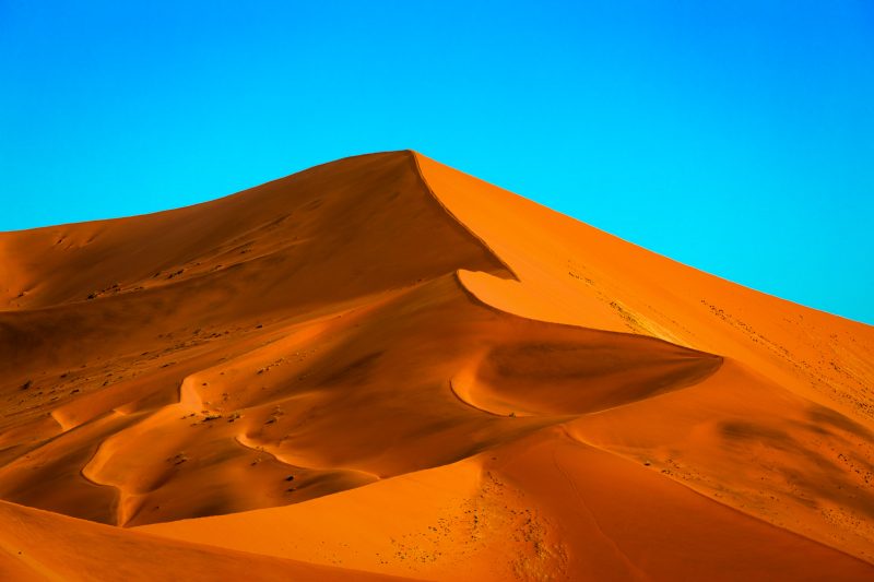 A huge dune climbs to the sky